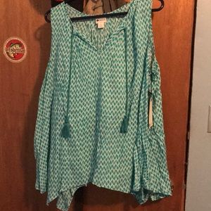 Sleeveless blouse never worn with tags.